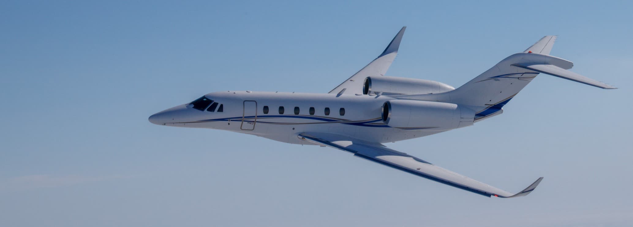 Cessna Citation X / Citation X+ private jet on the runway, world's fastest civil aircraft available for charter through Hogani Jets with seating for up to 9 passengers and 3,460 nautical mile range.