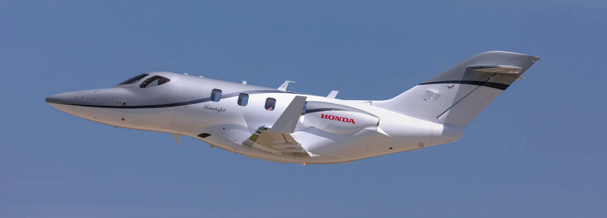 HondaJet charter aircraft with over-the-wing engines for fast regional private flights