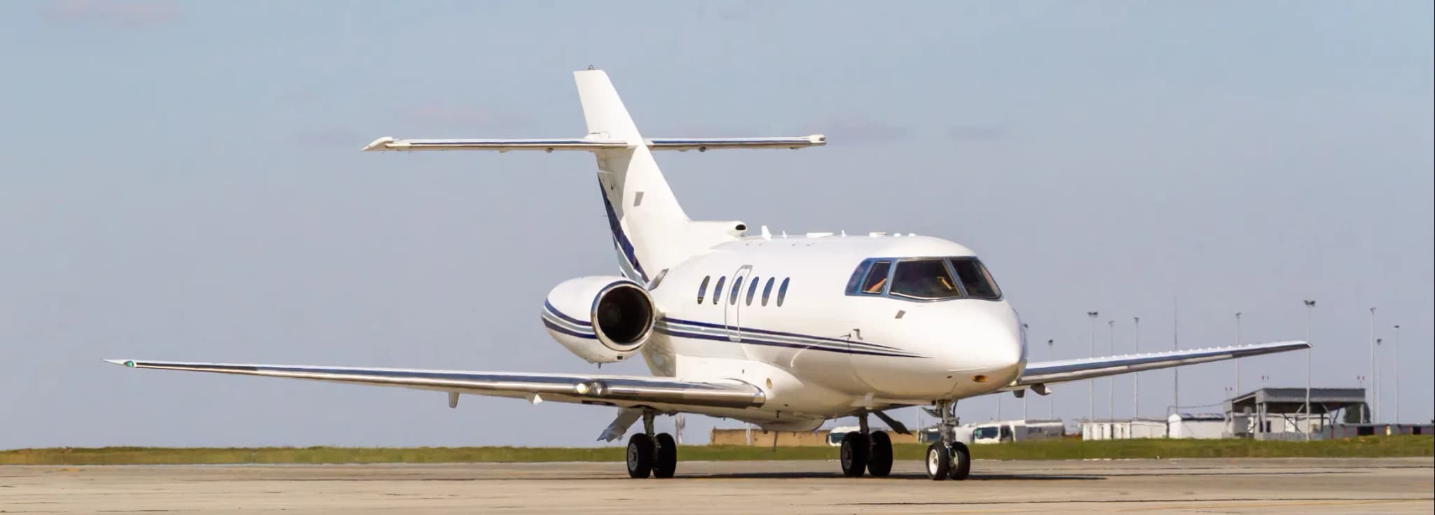 Hawker 800XP private jet parked on the tarmac for executive midsize charter flights.