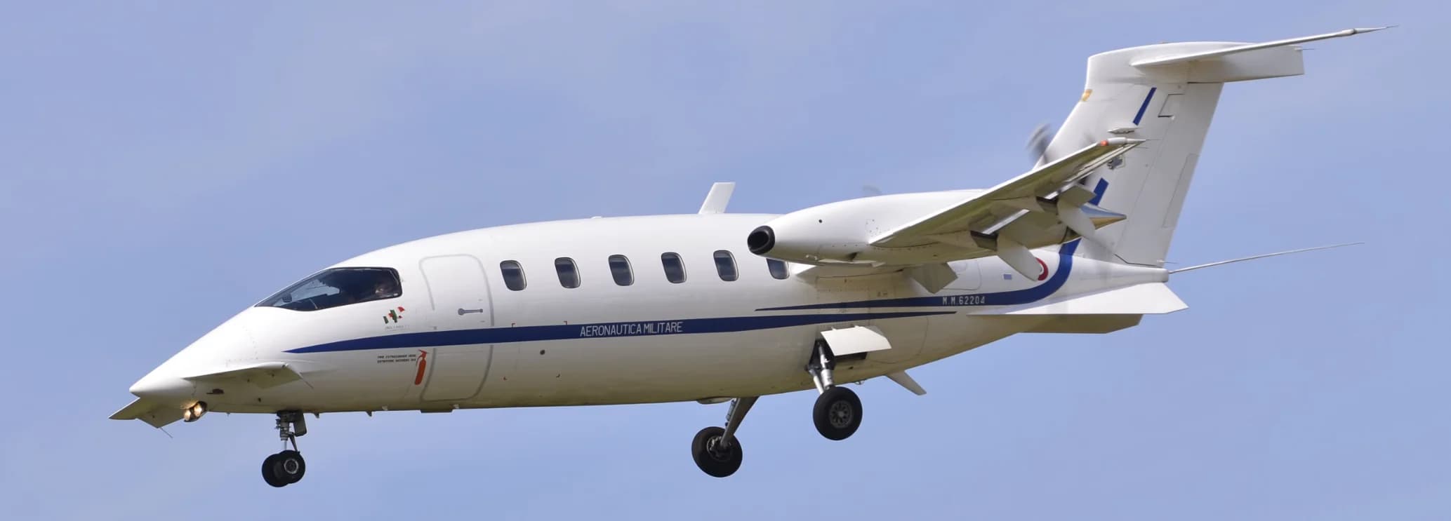 Piaggio Avanti II twin-engine turboprop on the runway, highlighting its distinctive pusher-prop configuration, sleek design, and near-jet regional charter performance.