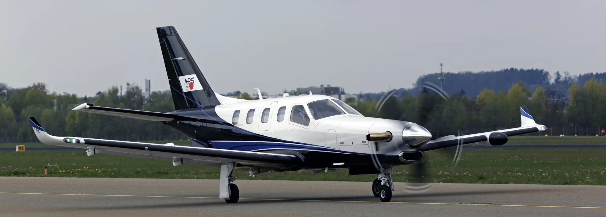 Front three-quarter view of a Daher TBM 900 private turboprop aircraft available for regional charter flights with Hogani Jets.
