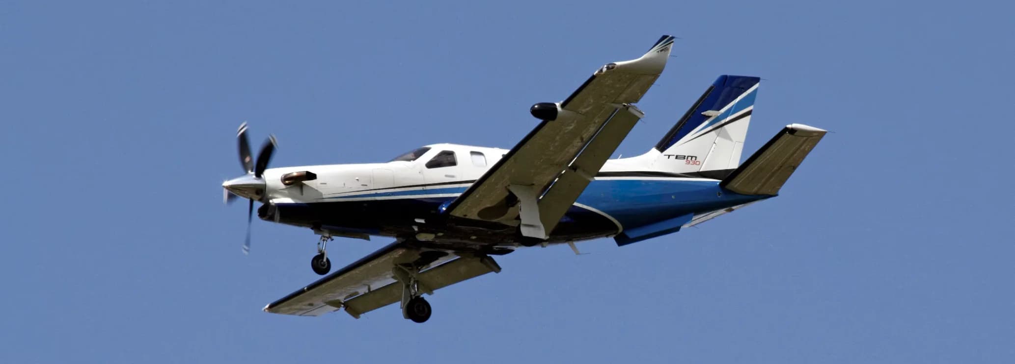 Front three-quarter view of a Daher TBM 940 private turboprop aircraft available for regional charter with Hogani Jets.