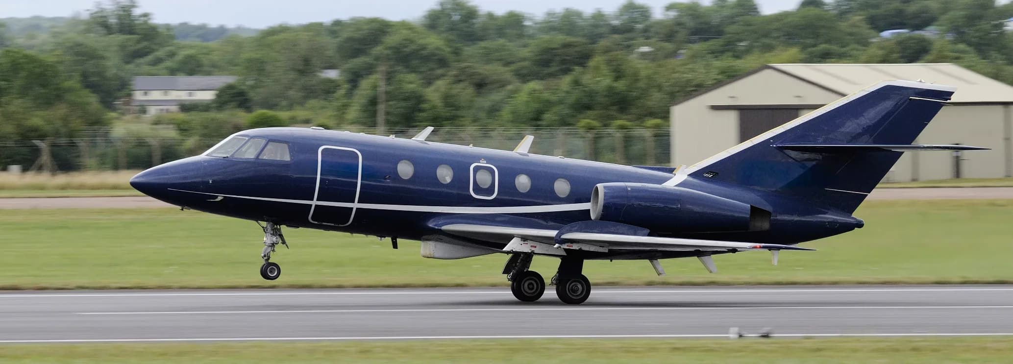 Spacious cabin interior of a Dassault Falcon 20 showing eight-seat executive seating configuration