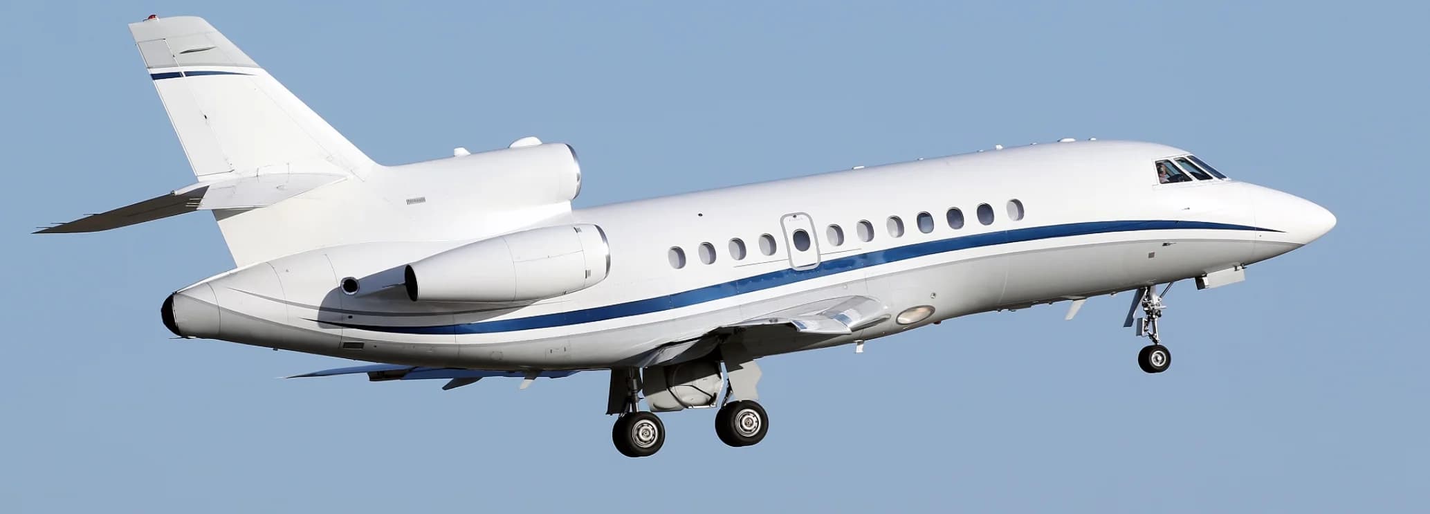 Falcon 900 private jet cabin with seating for up to 16 passengers
