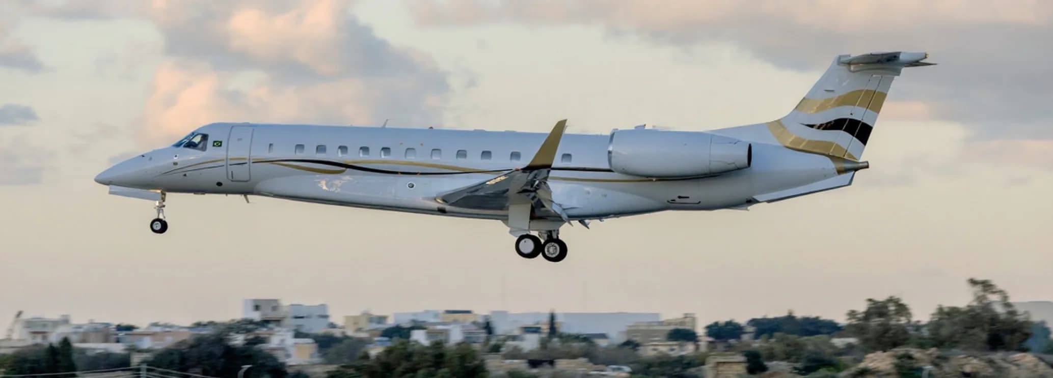 Embraer Legacy 650 private jet charter aircraft on the runway
