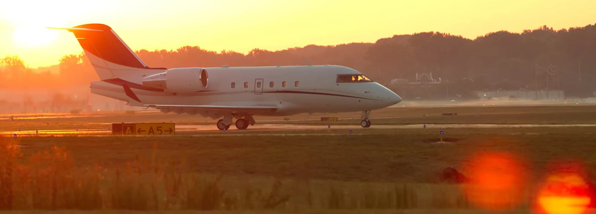 Spacious wide stand-up cabin interior showing double club executive seating in a Bombardier Challenger 604