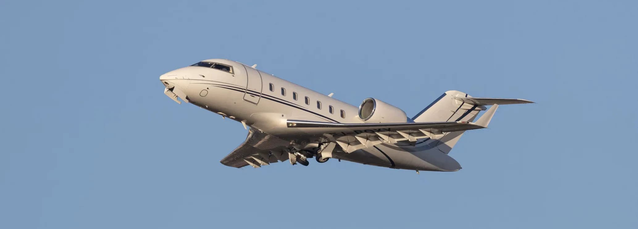 Spacious wide stand-up cabin interior showing double club executive seating in a Bombardier Challenger 605