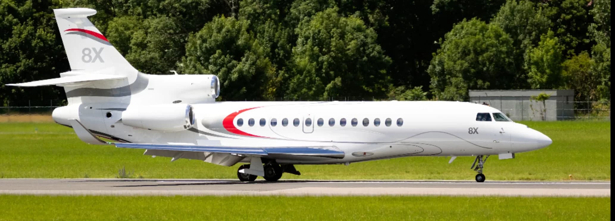 Dassault Falcon 8X ultra long range private jet parked on the airport tarmac ready for a charter flight