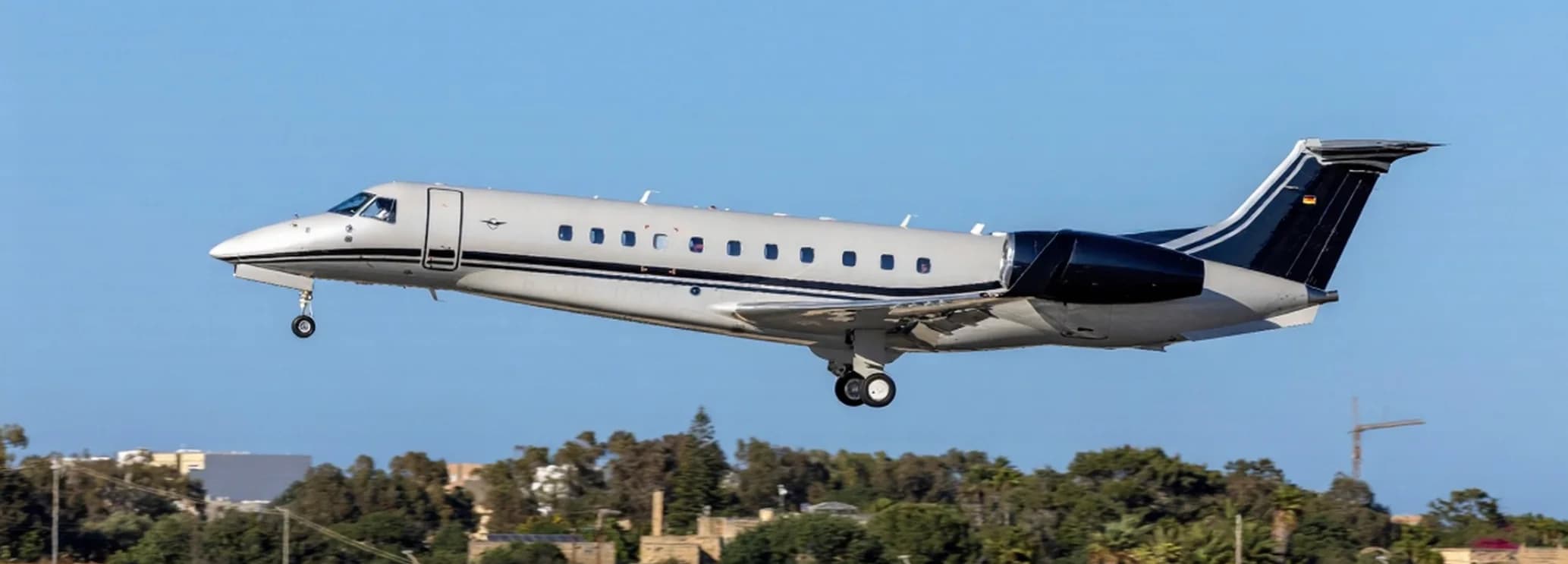 Restyled three-zone cabin interior of an Embraer Legacy 650E private jet