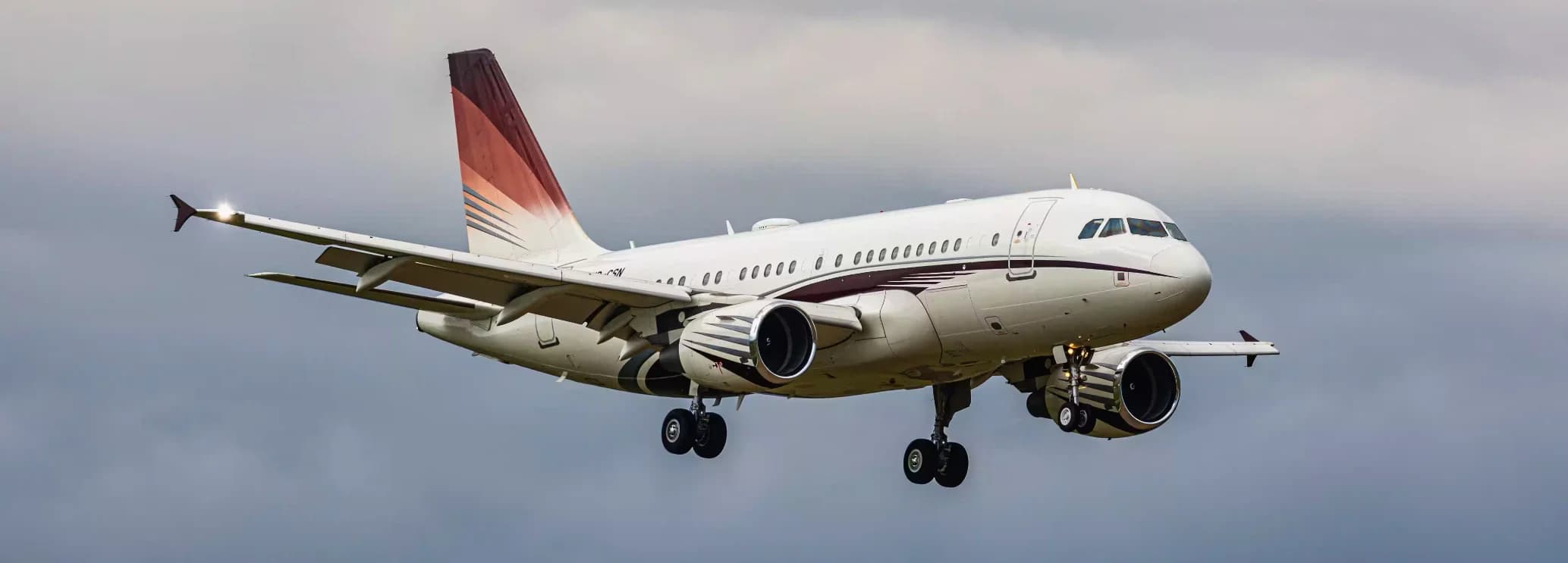 Airbus ACJ319/neo corporate jet exterior on tarmac displaying CFM LEAP-1A engines and 72-foot cabin for 50-passenger executive charter