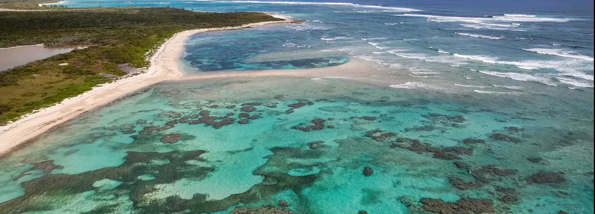 White-sand beach and turquoise water at Fernandez Bay.