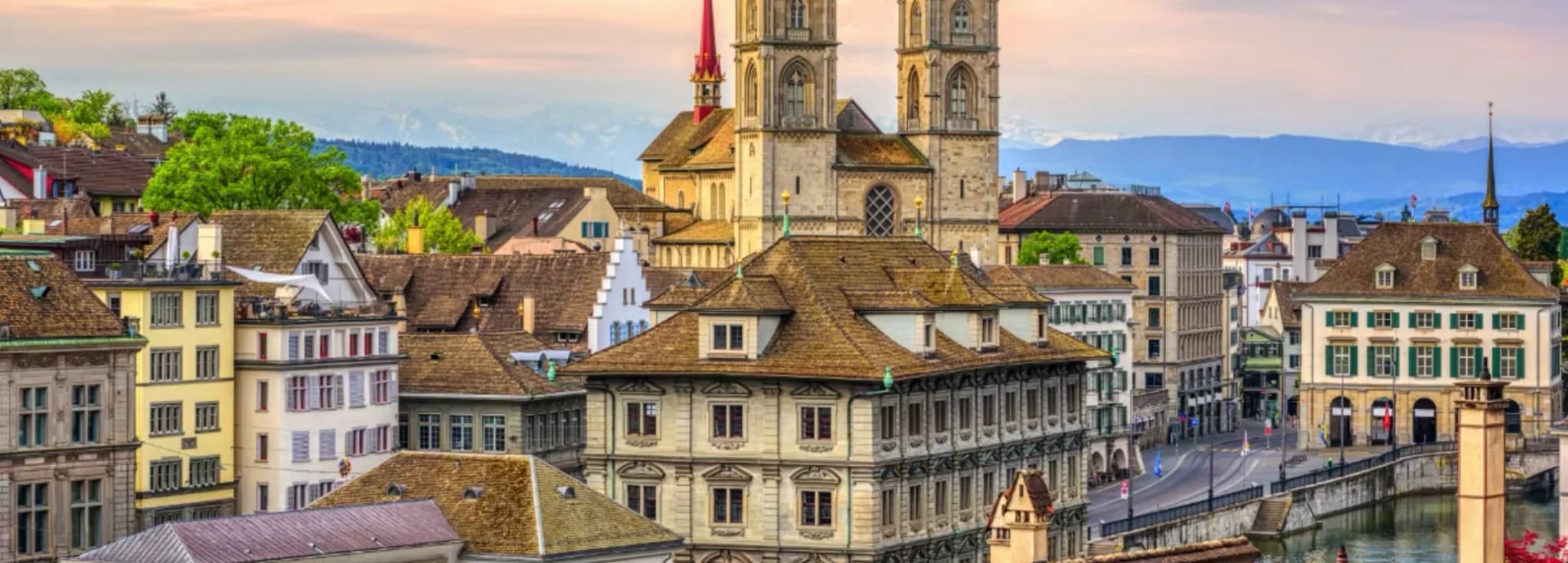 Rooftops of Zurich Old Town leading up to the twin towers of Grossmünster cathedral