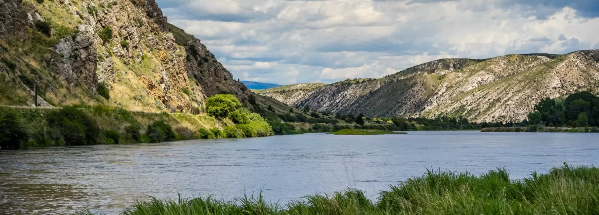 Scenic view of the Gallatin River flowing through rugged mountain canyon terrain near Bozeman, Montana.