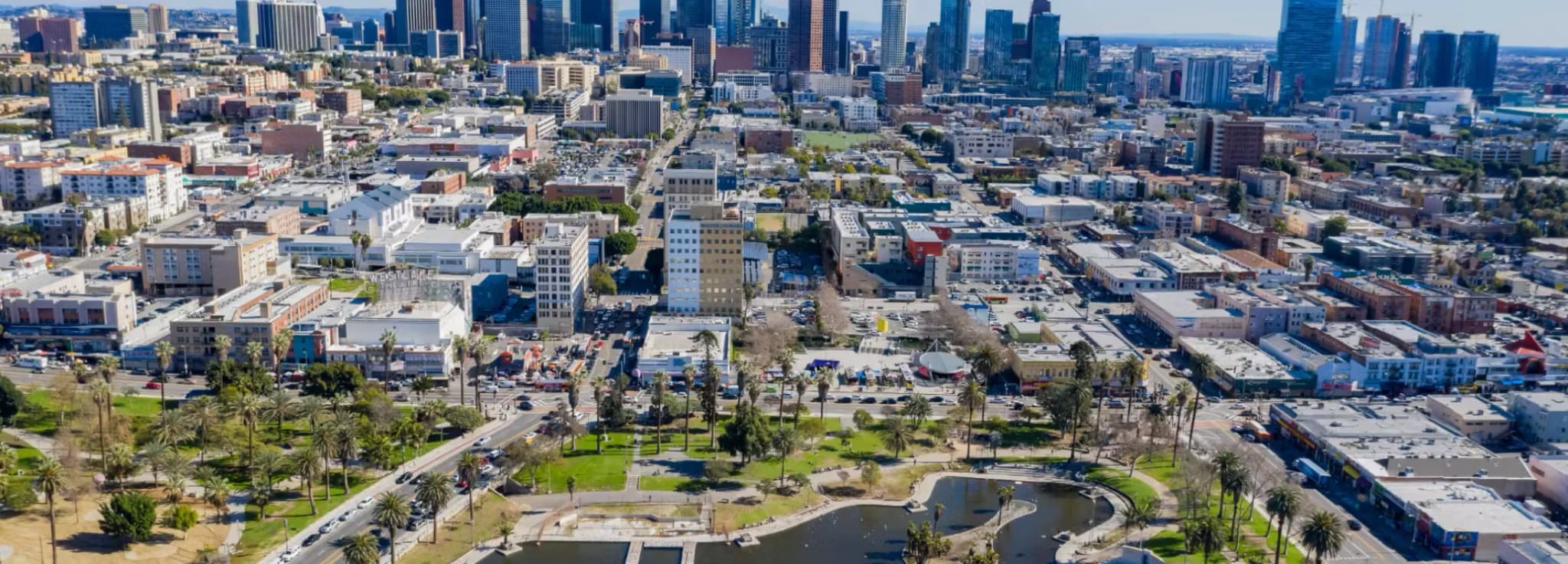 Private jet charter to Los Angeles, California, with the downtown skyline and the San Gabriel Mountains