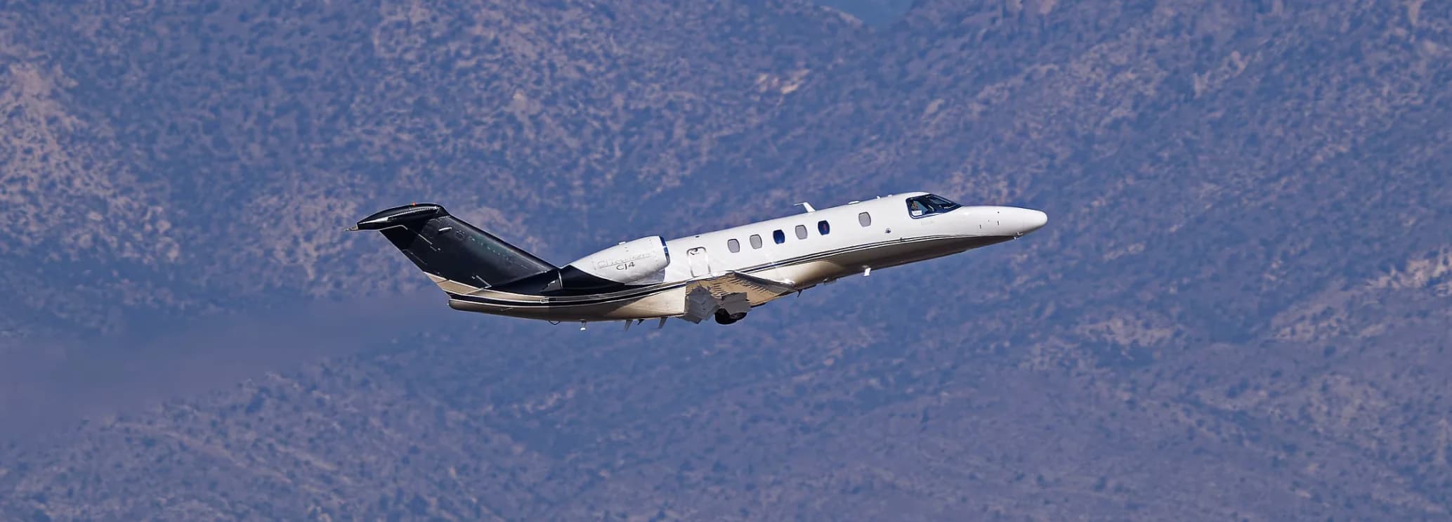 Cessna Citation CJ4 flagship light jet available for private charter through Hogani Jets on the airport apron