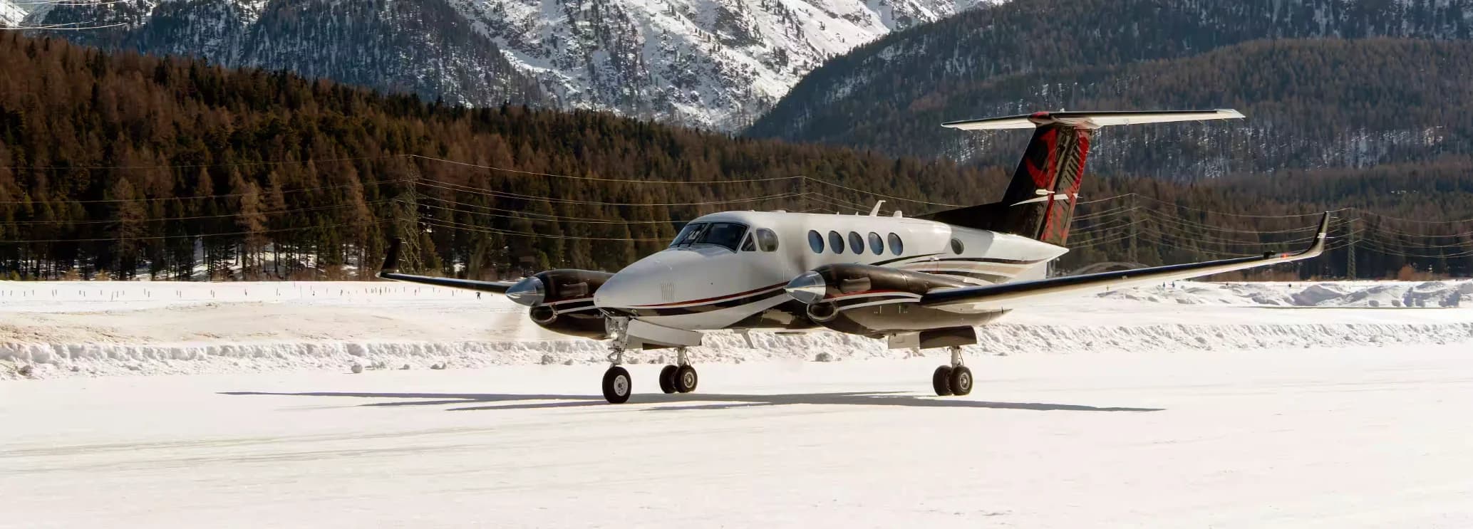 King Air 250 private turboprop aircraft parked on the tarmac for executive charter flights.