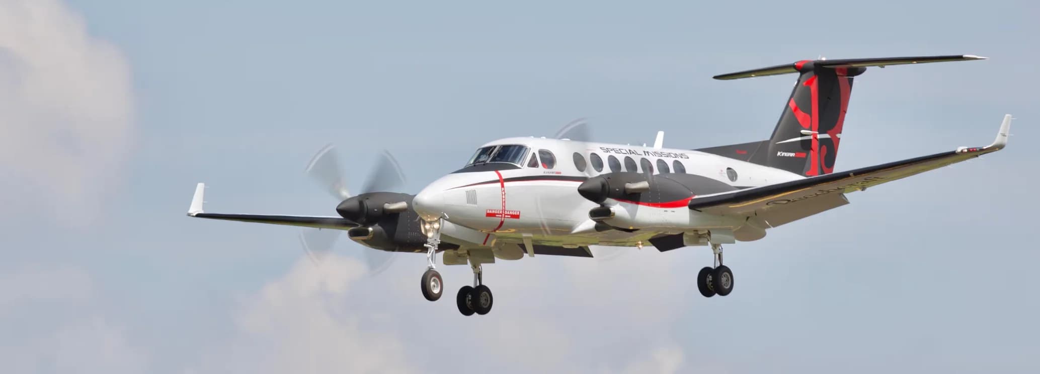 Beechcraft King Air 360 turboprop aircraft on the runway, featuring a spacious executive cabin and advanced avionics for private charter flights.