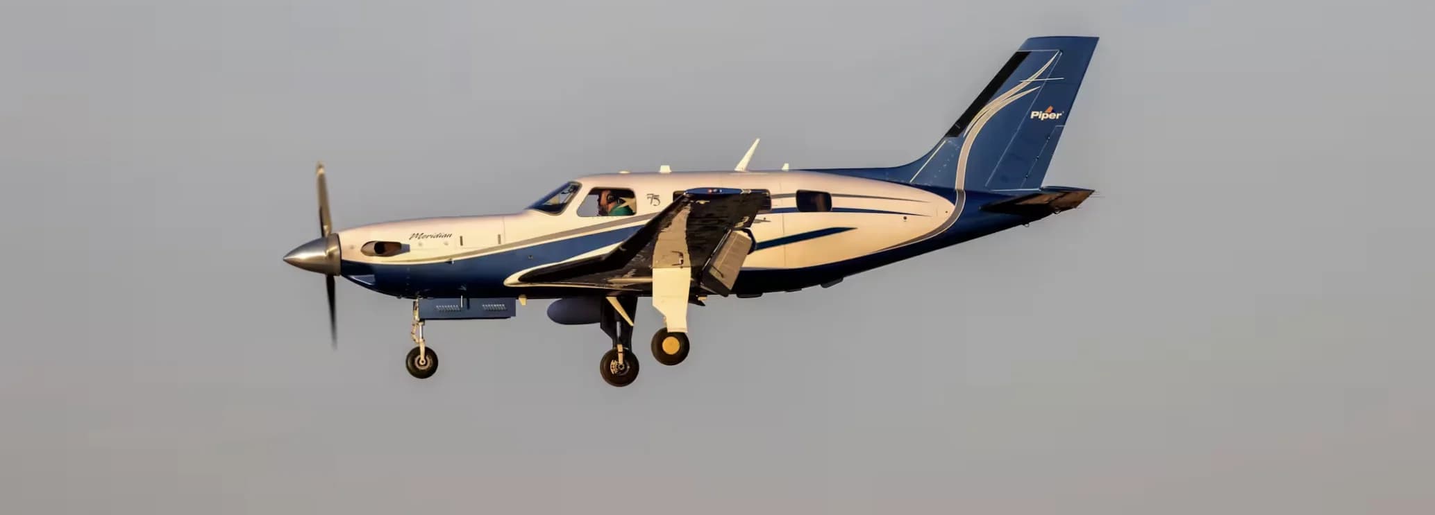 Modern Piper M500 cabin with executive leather seating for regional private charter flights.