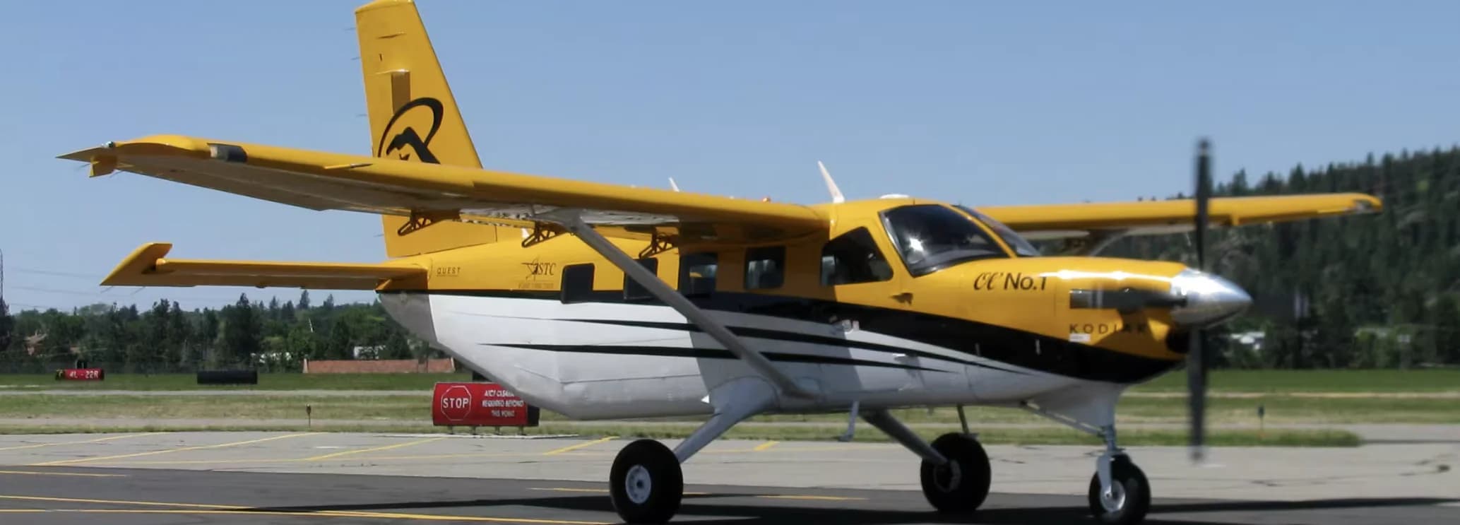 Quest Kodiak 100 single-engine turboprop parked on an unpaved backcountry runway