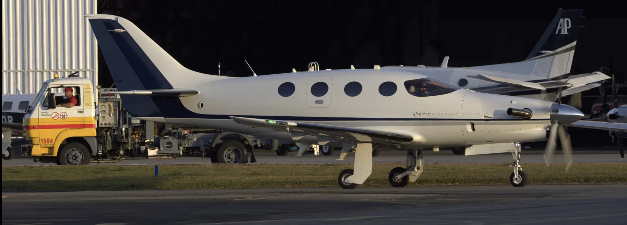Epic E1000 carbon fiber single-engine turboprop aircraft on the tarmac