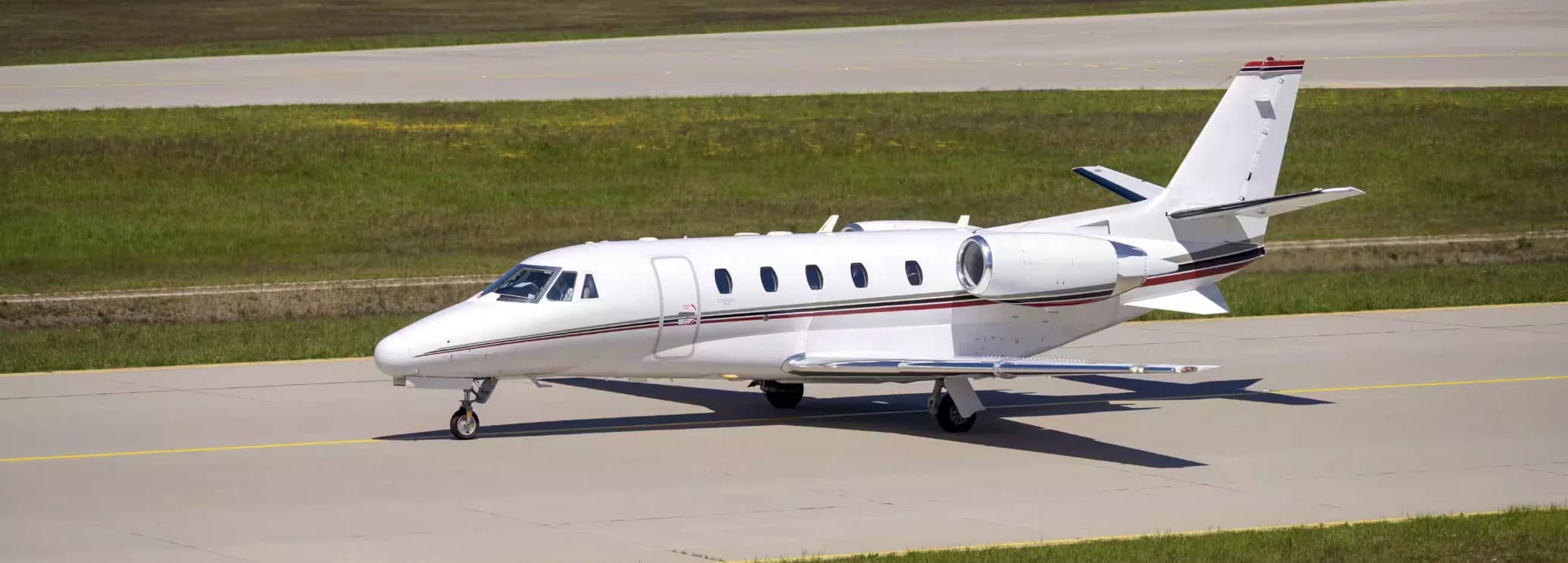 Cessna Citation Excel midsize charter jet parked on the ramp, the original 560XL available to charter from $3,500 per hour