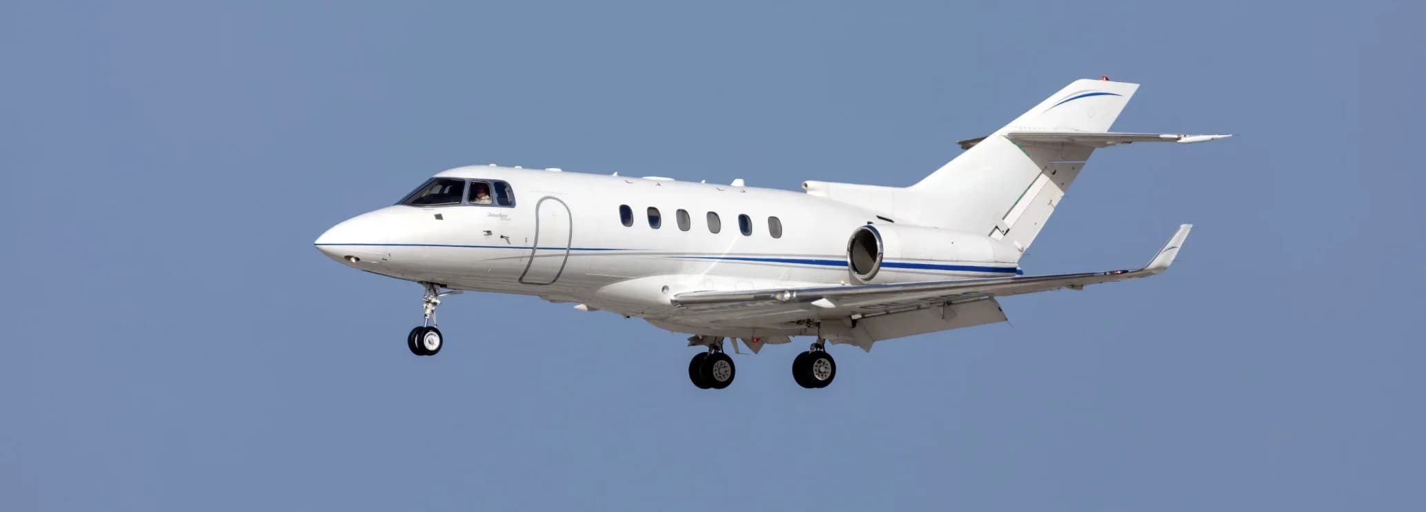 Hawker 900XP private jet with composite winglets and twin Honeywell TFE731-50R engines on runway