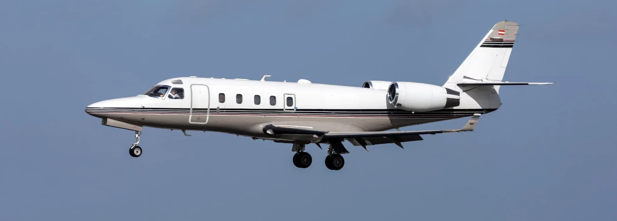 Gulfstream G100 midsize private jet with winglets parked on the airport ramp