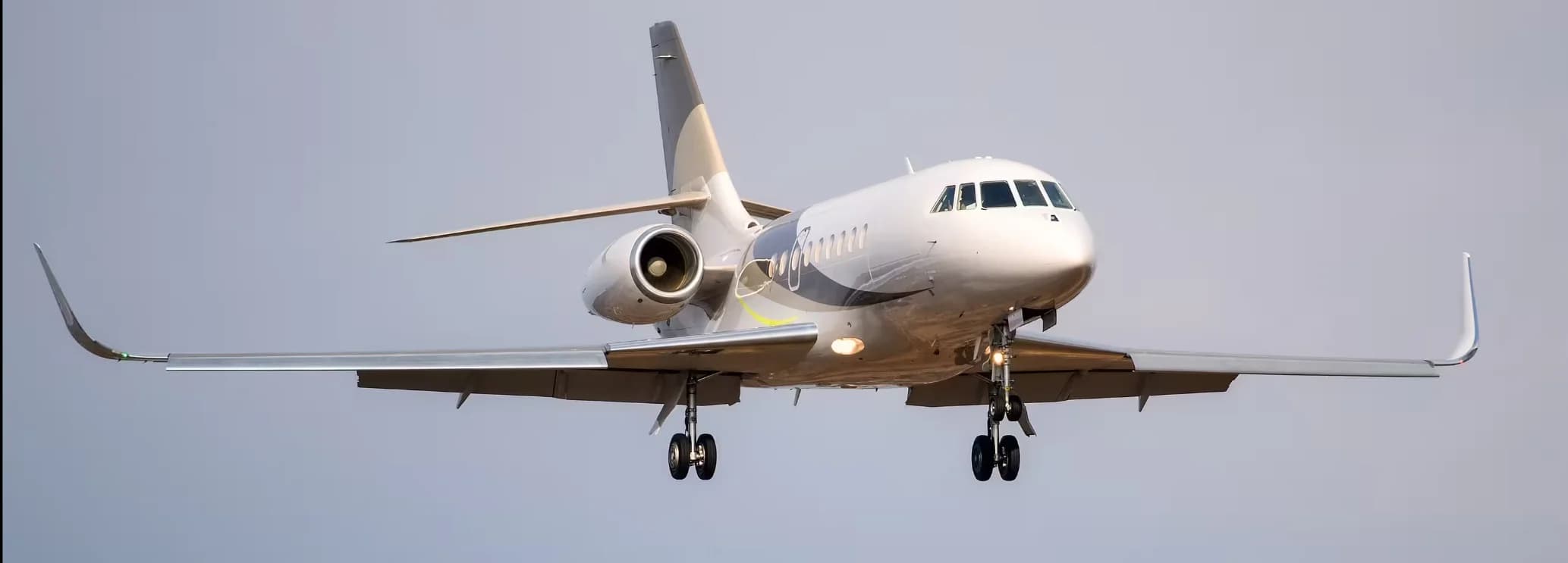 Dassault Falcon 2000S super midsize private jet parked on the airport ramp