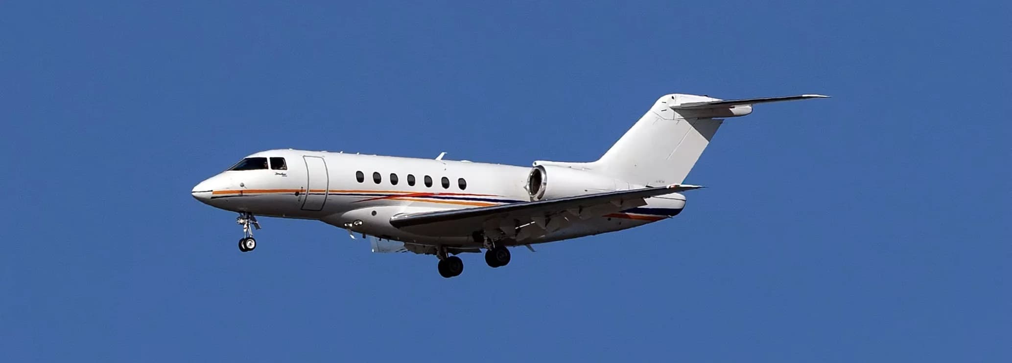 Spacious wide stand-up cabin interior showing executive seating layout inside a Hawker 4000