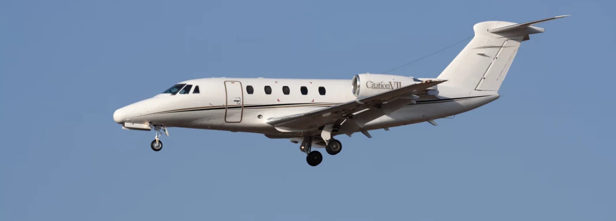 Cessna Citation VII midsize jet parked on the tarmac ready for charter flight booked through the official Hogani Jets website