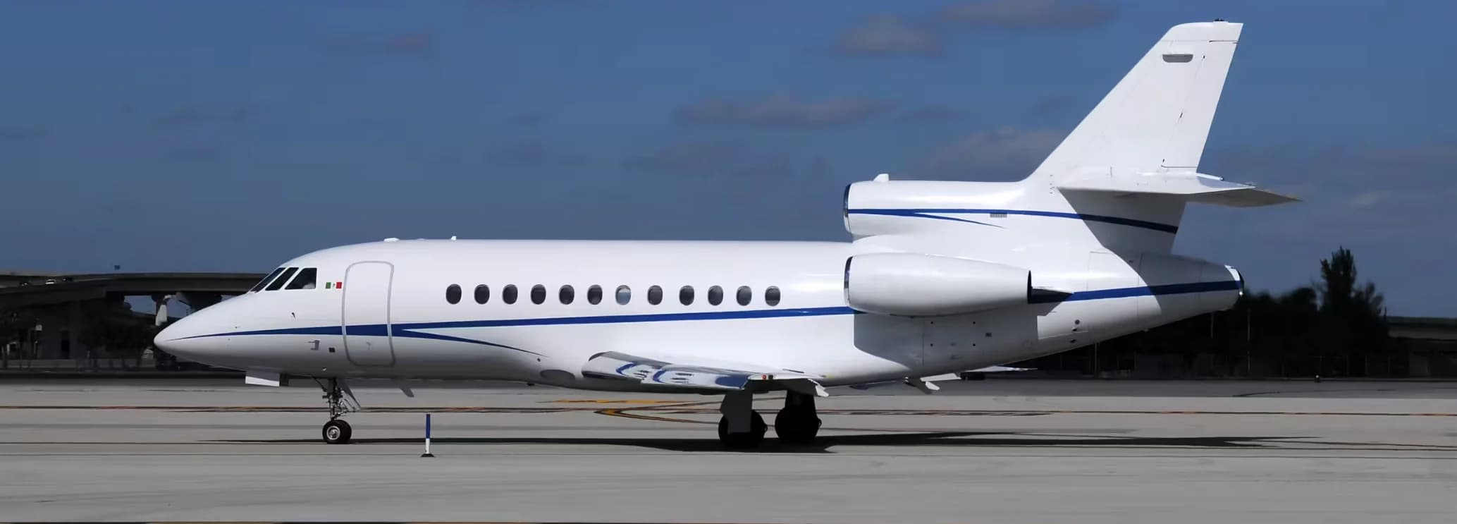 Exterior view of a Dassault Falcon 900EX EASy heavy jet on the ramp