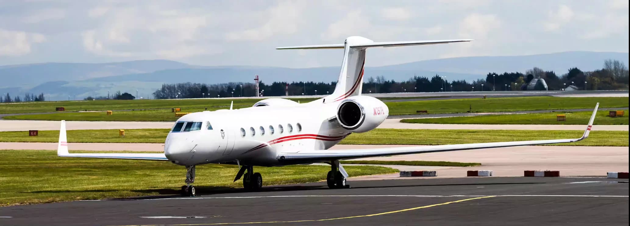 Gulfstream G550 ultra long range private jet parked on the airport tarmac ready for a charter flight