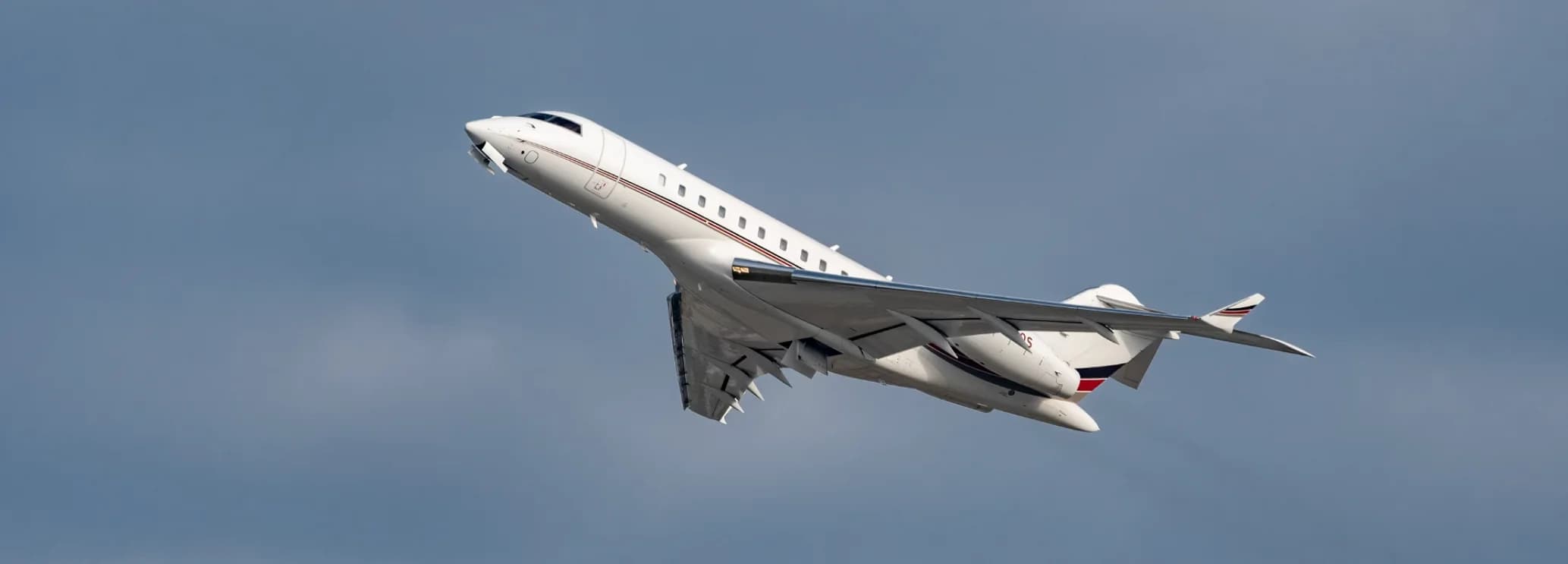 Bombardier Global 5000 long range private jet sitting on the airport ramp
