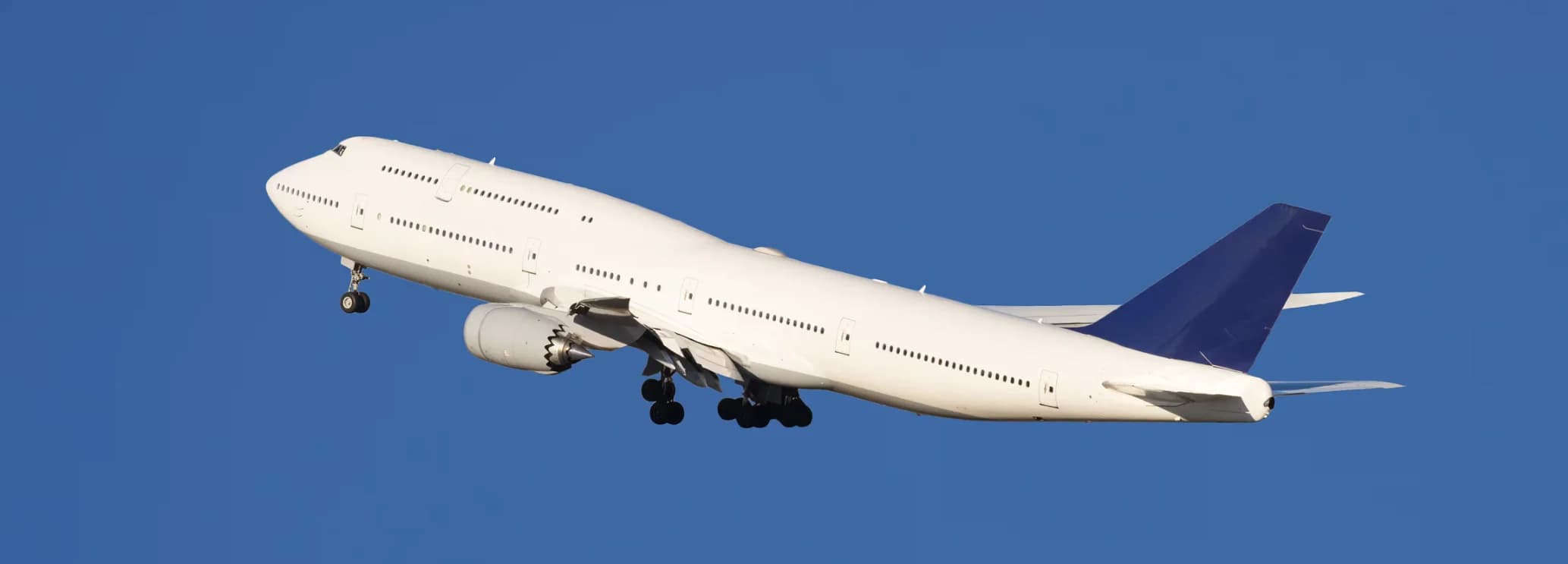 Boeing 747-8 VIP widebody airliner in flight showing iconic two-deck profile with upper deck owner suite and 176-foot main cabin