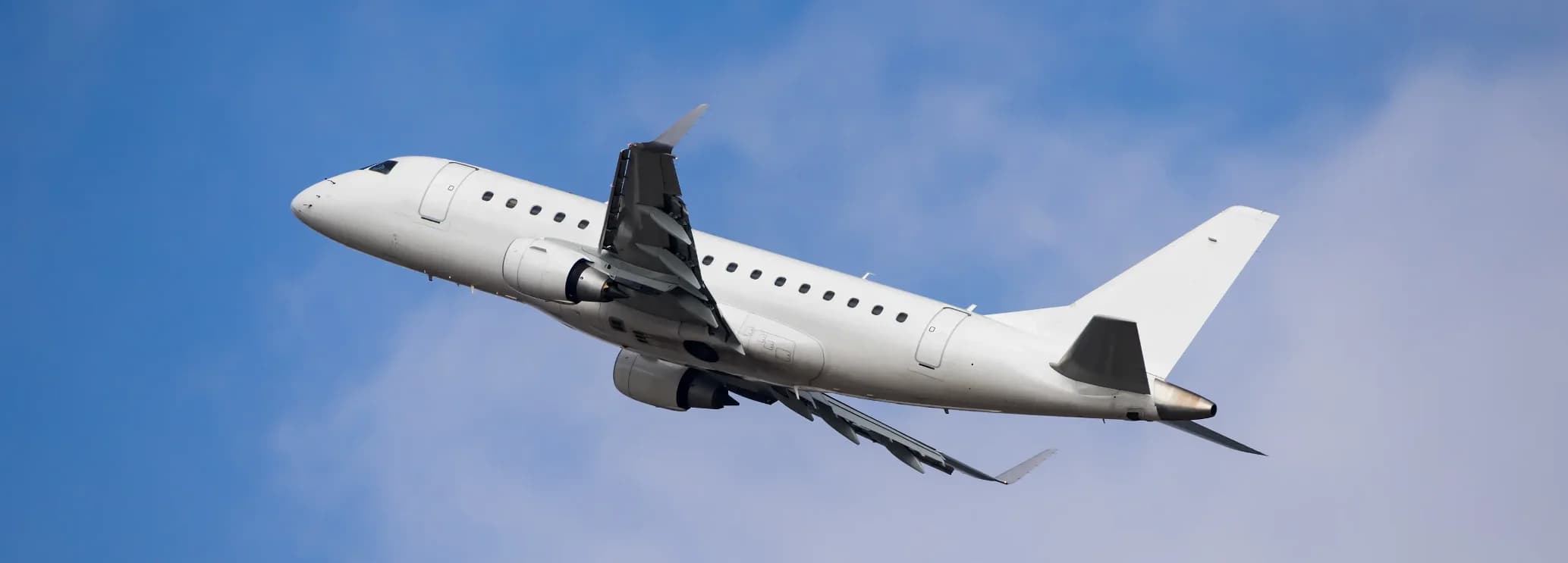 Embraer Lineage 1000E VIP airliner in flight showing E190-based airframe configured for 19 passengers with 4,600 nautical mile transatlantic range