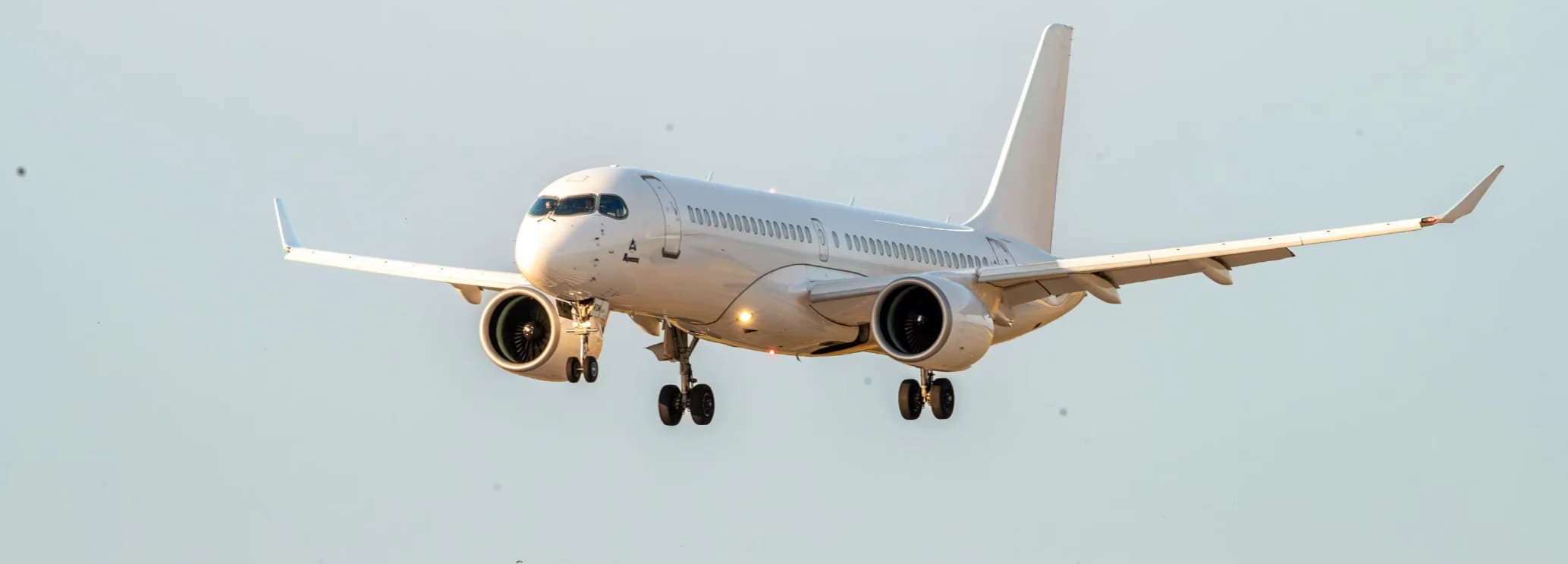 Luxury Airbus ACJ220 VIP cabin with lounge, conference seating, private suite, and enclosed lavatory