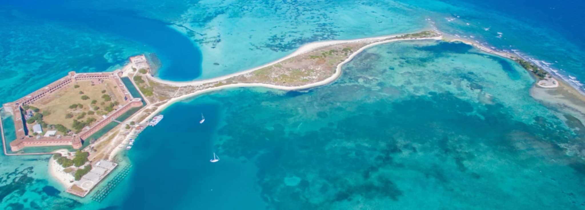 Private jet charter to Key West, Florida, over the turquoise water of the Florida Keys