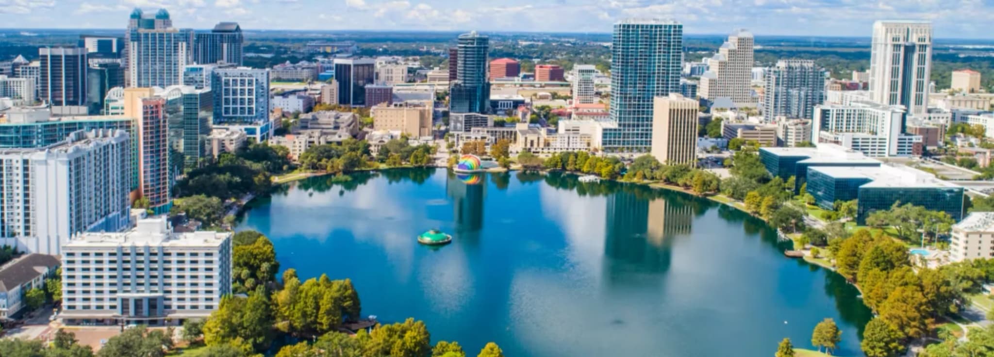 Private jet charter to Orlando, Florida, with the downtown skyline and Lake Eola